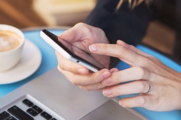 girl on mobile phone at online checkout