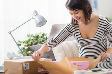 women open box with date & time-based delivery