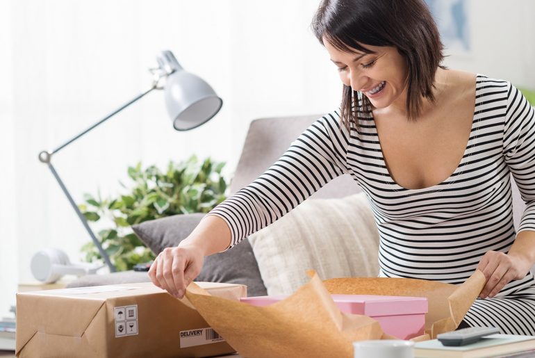 Time Slot Delivery: How to Make It a Hit with Your Customers women open box with date & time-based delivery