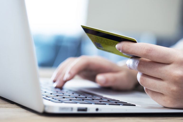 How to Customize Your Shopify Checkout for Better Conversions customer on computer on a shopify checkout