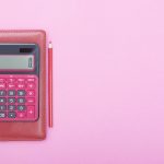calculator on a pink background