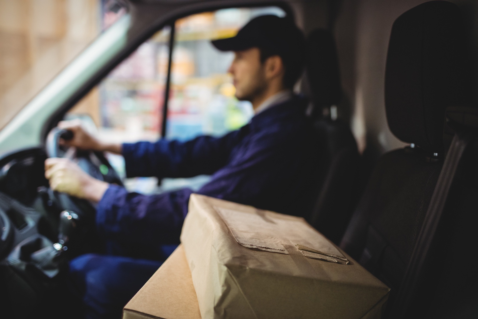 How to Offer Local Delivery That’s Affordable and Worth Your Time man in truck doing local delivery to a customer