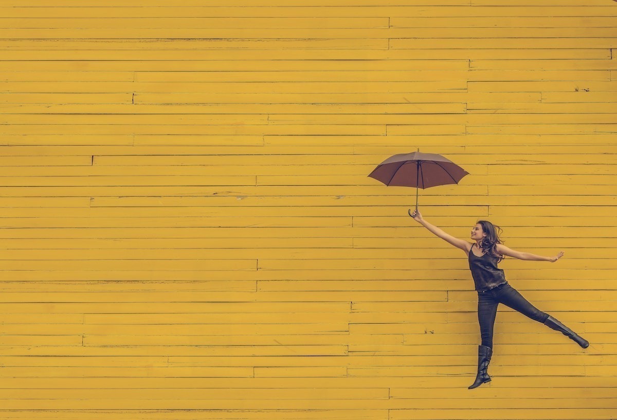 How to Keep Your Mental Health in Check When Dealing with Uncertainty women with umbrella good mental health