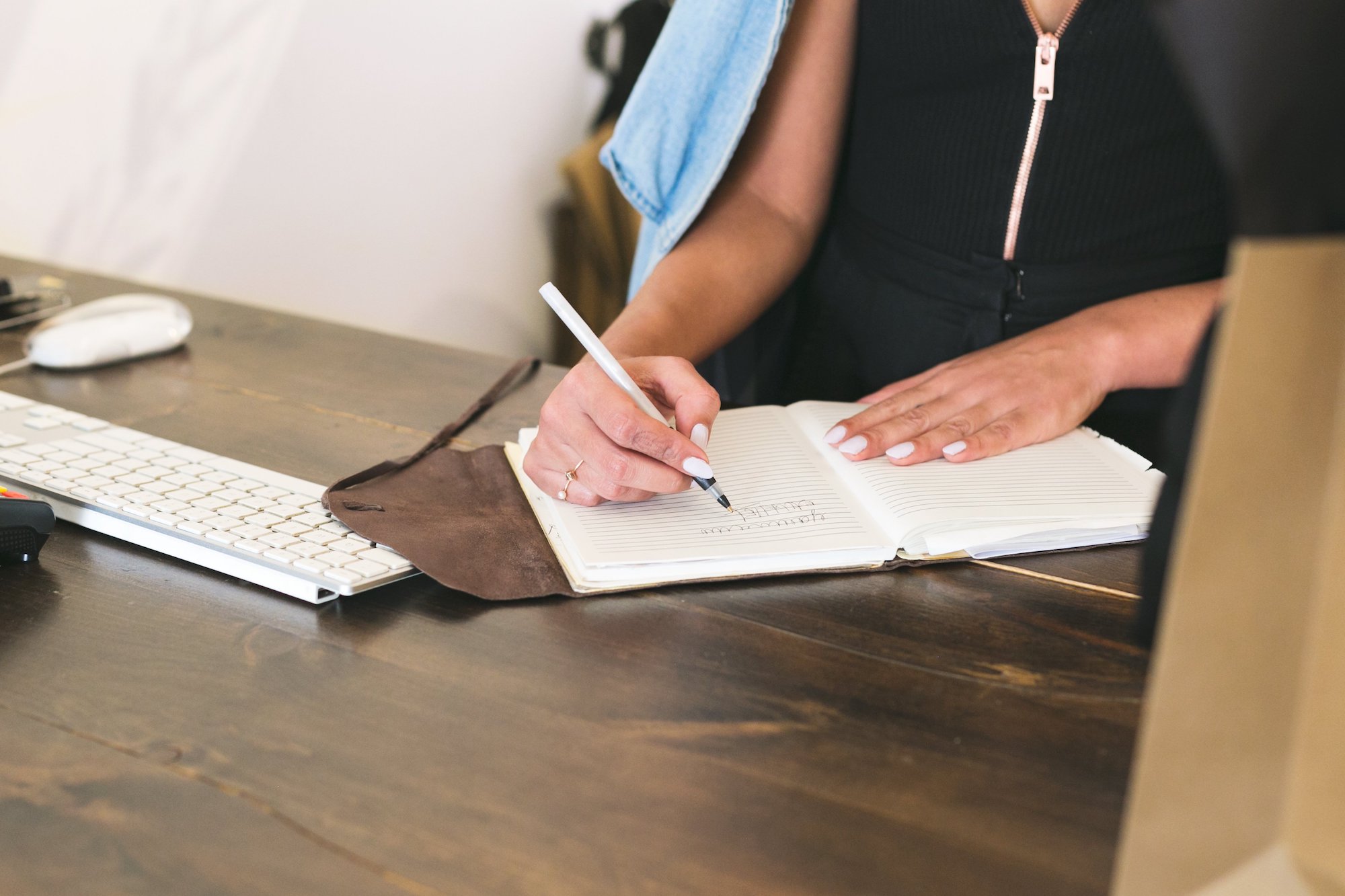 Shipping as a Revenue Stream: How to Establish a Shipping Strategy that Works (Part 1) women taking notes on shipping strategy