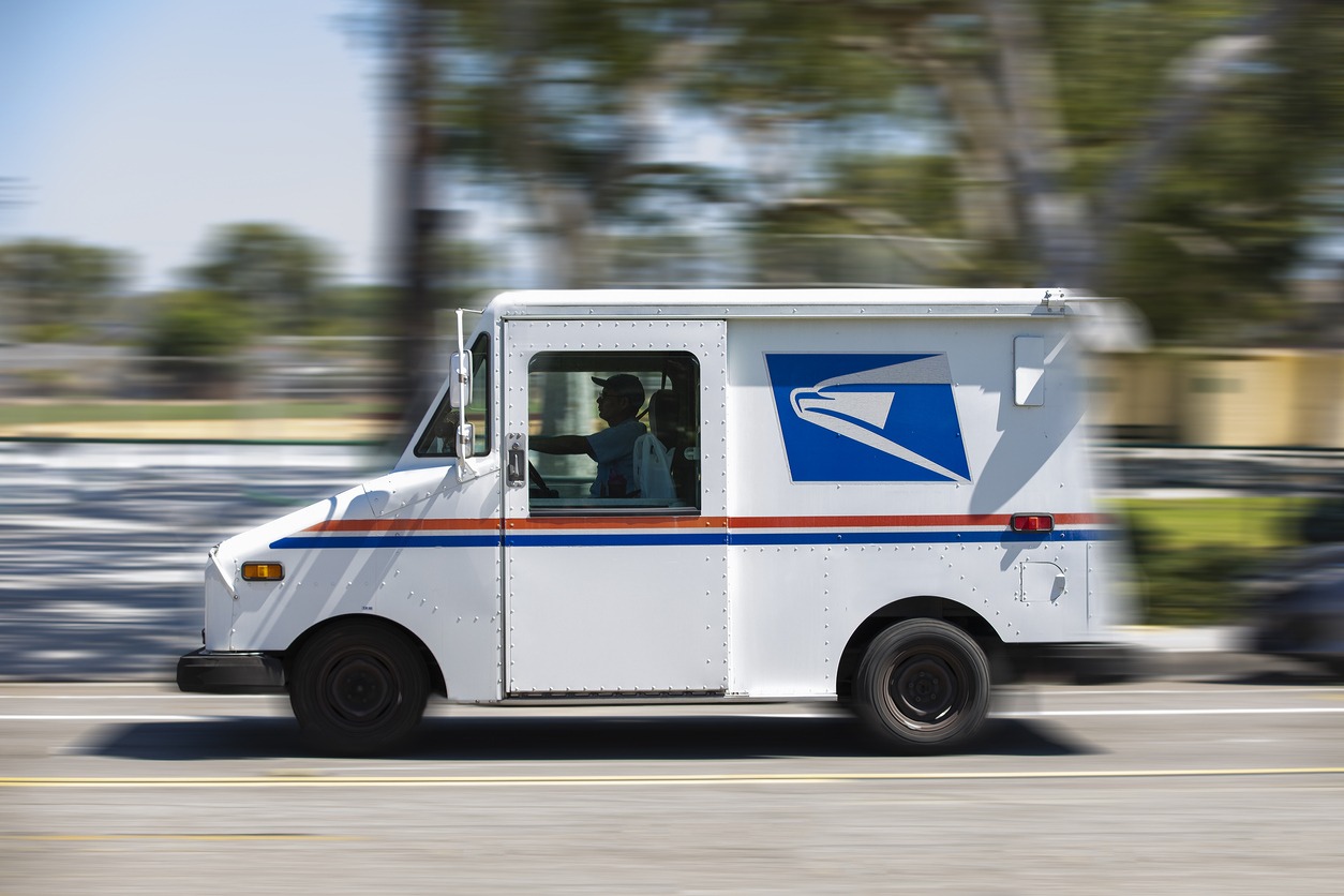 USPS Ground Advantage: What You Need to Know United States Parcel Service mail truck leaves for a delivery.