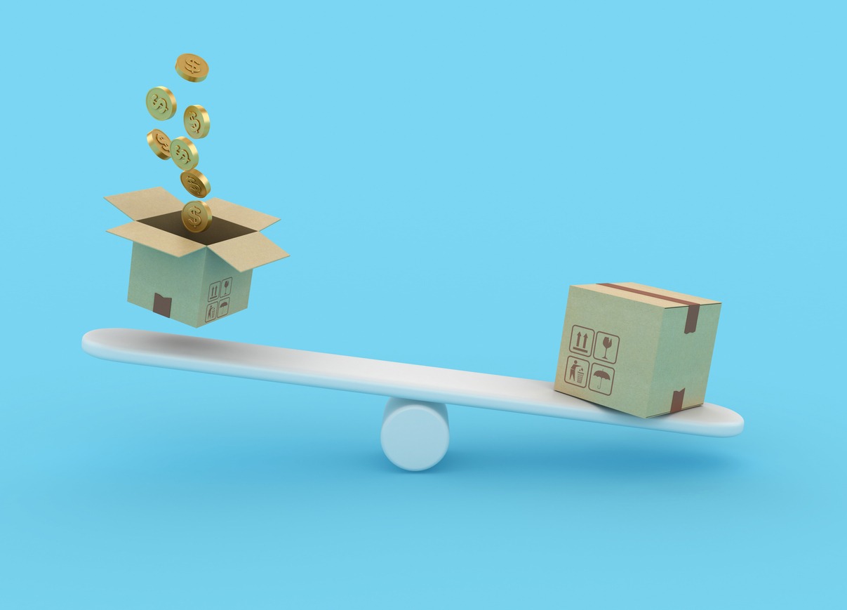Think Inside the Box with Dimensional Packing Box balanced on fulcrum to demonstrate the costs and benefits of dimensional shipping quotes.